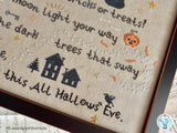 'Tis the Night Halloween Cross Stitch Pattern close up with haunted houses, crow, jack-o-lantern, and part of a poem.
